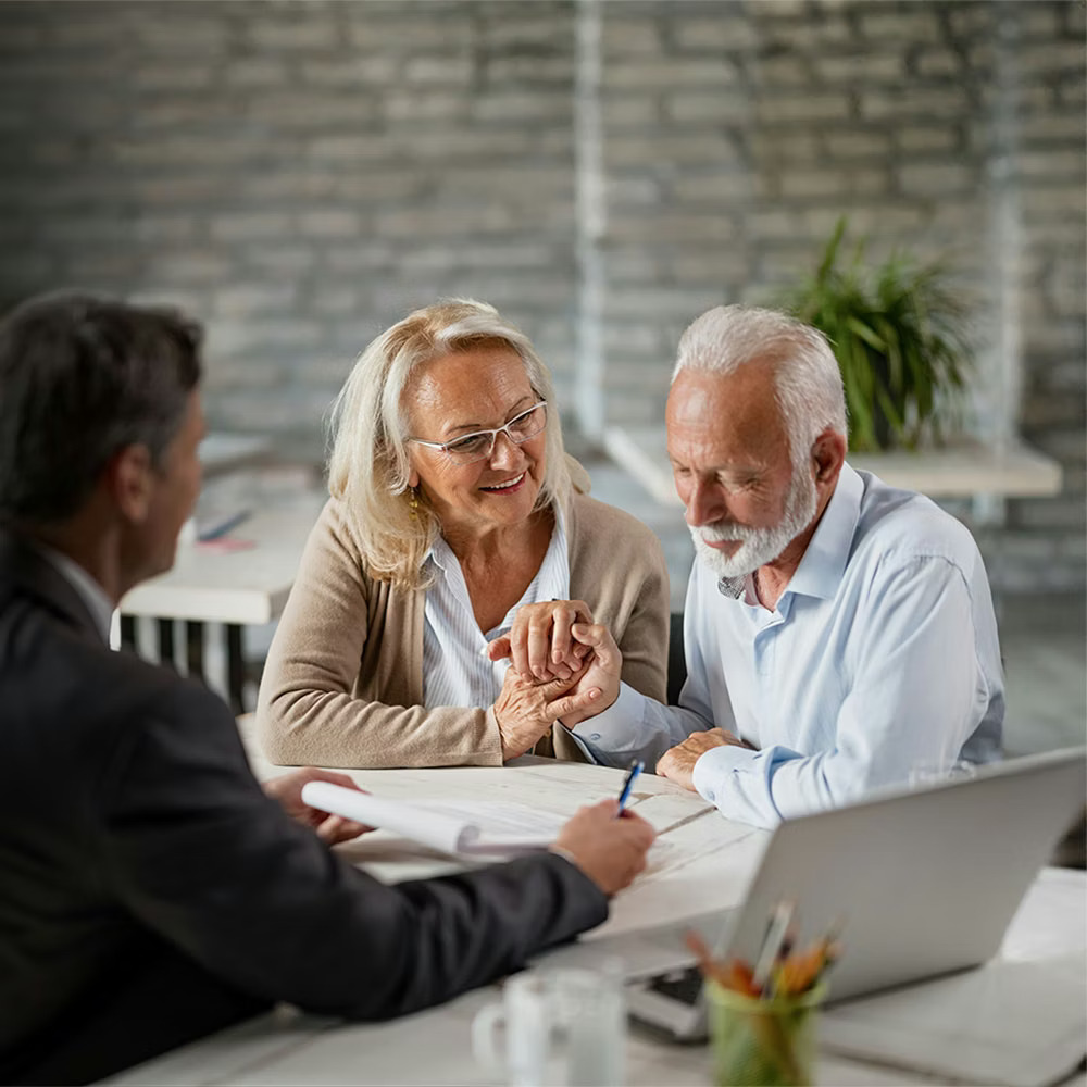 how to protect assets from nursing home costs in ohio - original_lawyer-discussing-estate-with-elderly-couple-mobile